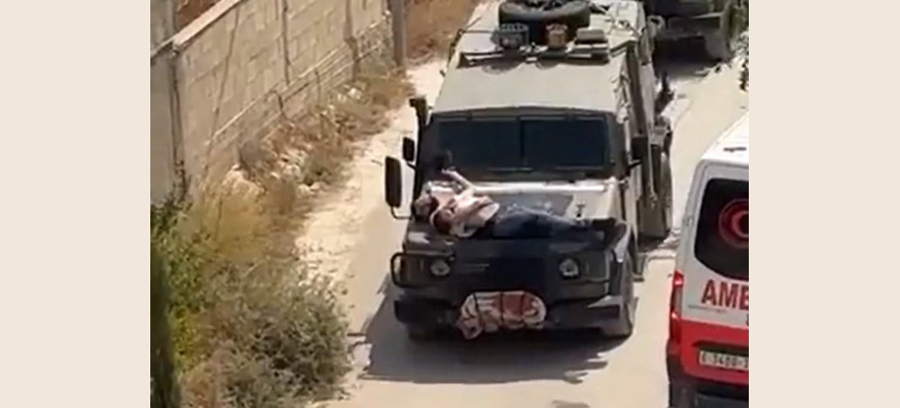 Outrage Over Video of Israeli Soldiers Driving With Injured Palestinian Strapped to a Jeep